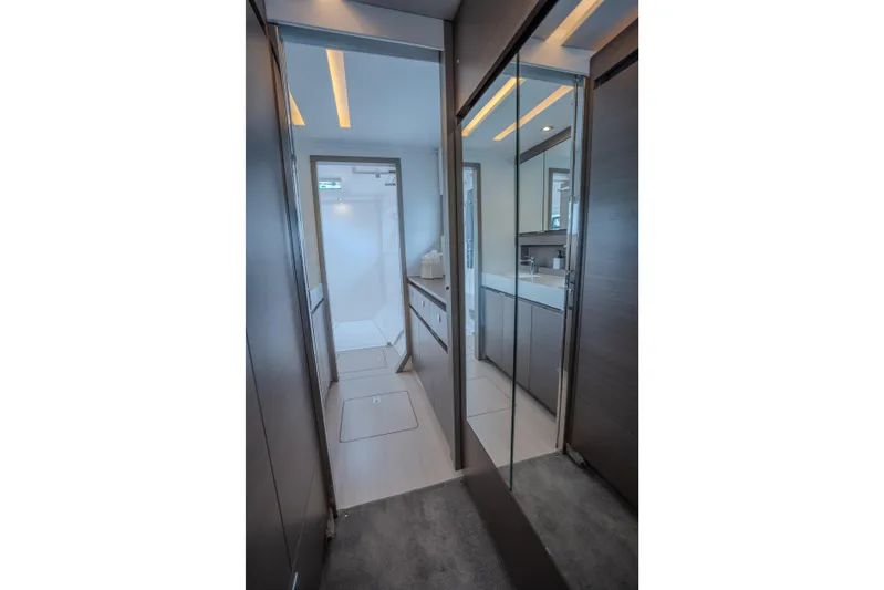 Althea Yacht Photos Pics Modern bathroom interior of 2025 Leopard 53 Powercat yacht, featuring sleek design and mirrored surfaces.