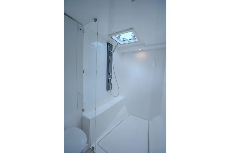 Althea Yacht Photos Pics Modern bathroom interior on 2025 Leopard 53 Powercat yacht, featuring sleek design and skylight.