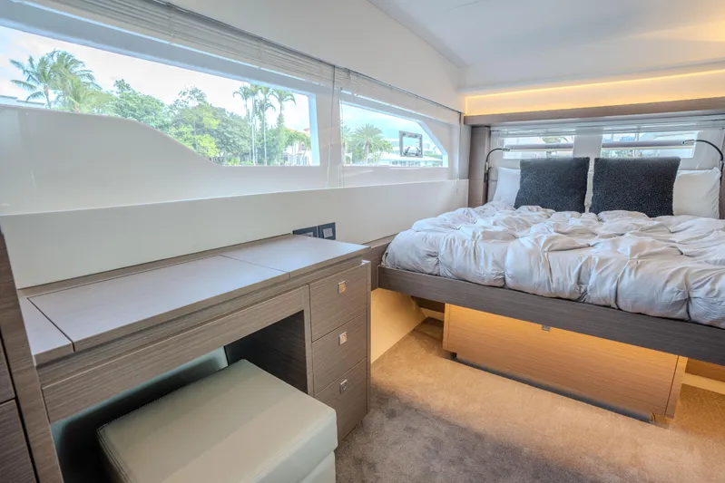 Althea Yacht Photos Pics Luxurious bedroom interior of 2025 Leopard 53 Powercat yacht with modern furnishings.