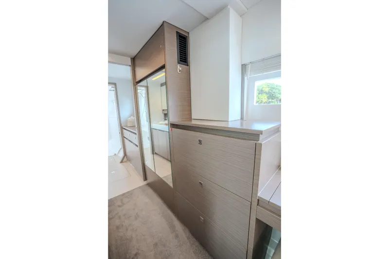 Althea Yacht Photos Pics Interior of 2025 Leopard 53 Powercat yacht, featuring modern cabinetry and sleek design.