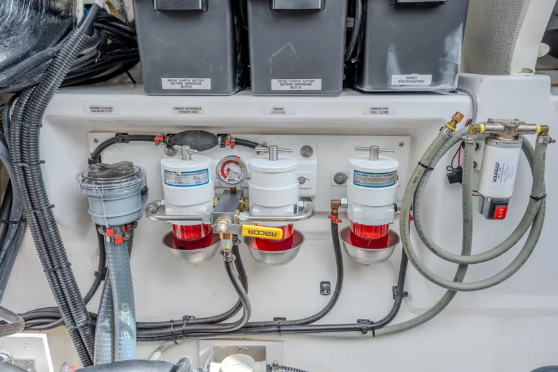 Althea Yacht Photos Pics Engine compartment of 2025 Leopard 53 Powercat with fuel filters and battery setup.