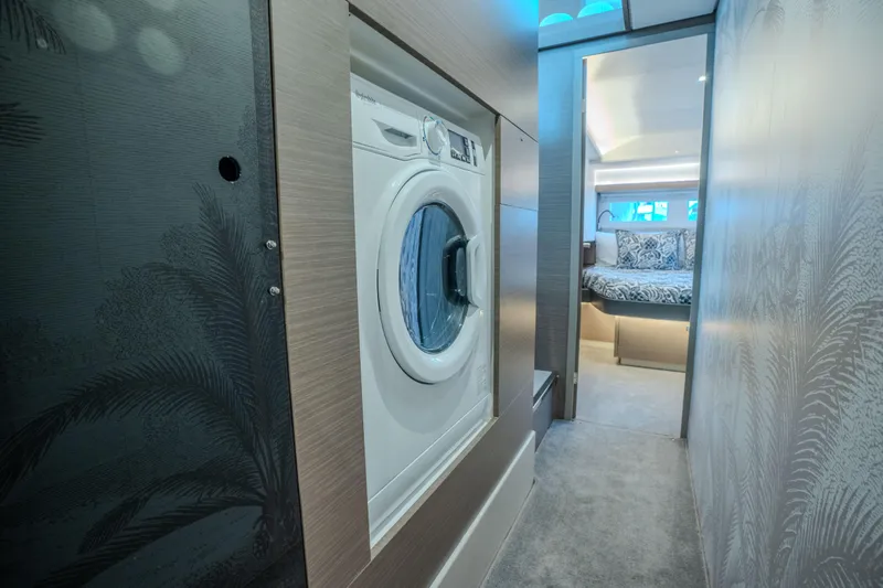 Althea Yacht Photos Pics Laundry area and bedroom in 2025 Leopard 53 Powercat yacht interior.