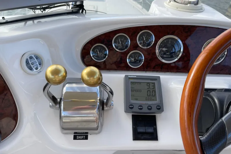 Yacht Photos Pics Control panel of a 2000 Sea Ray 400 Sedan Bridge with gauges and navigation display.