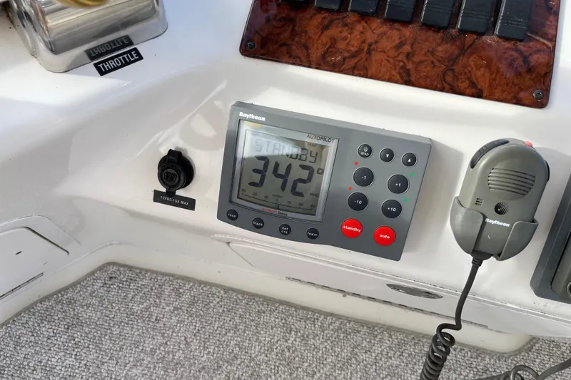  Yacht Photos Pics Control panel of a 2000 Sea Ray 400 Sedan Bridge with Raytheon autopilot system.