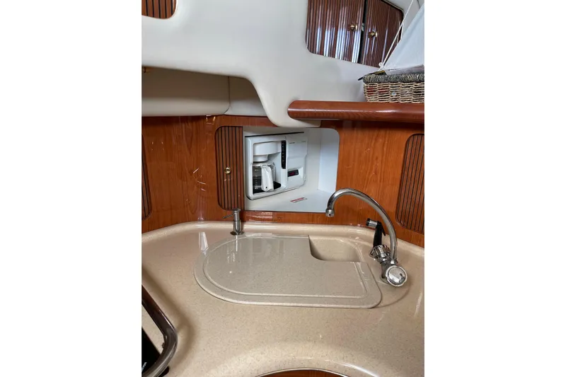  Yacht Photos Pics 2000 Sea Ray 400 Sedan Bridge kitchen with sink and built-in coffee maker.