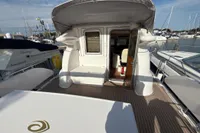2023 Elling E4 yacht deck with open cabin door, docked at marina.
