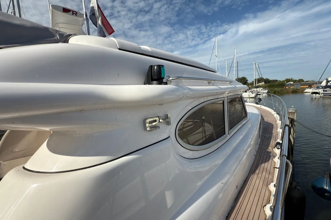 2023 Elling E4 yacht docked at marina, showcasing sleek design and modern features.