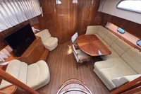 Luxurious 2023 Elling E4 yacht interior with elegant wood finish and plush seating.