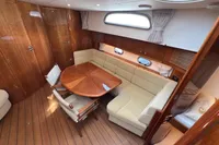 Luxurious 2023 Elling E4 yacht interior with elegant wood finish and cozy seating area.