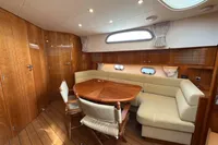 Luxurious 2023 Elling E4 yacht interior with wooden finishes and comfortable seating area.
