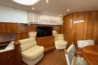 Luxurious interior of 2023 Elling E4 yacht with elegant wood finish and comfortable seating.