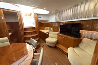 Luxurious interior of 2023 Elling E4 yacht with wood finishes and modern amenities.
