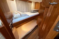 2023 Elling E4 yacht interior with wooden bunk beds and elegant design.