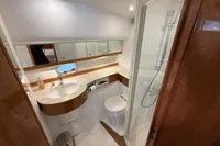 Luxurious 2023 Elling E4 yacht bathroom with modern fixtures and elegant wood accents.