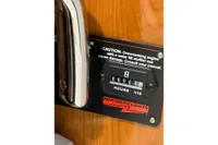 Hour meter on 2023 Elling E4 boat, caution label, Northern Lights branding.