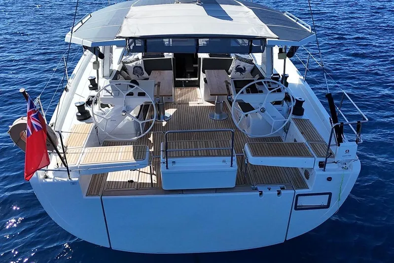 Nil Yacht Photos Pics 2024 Hanse 588 yacht with dual steering wheels on open sea.