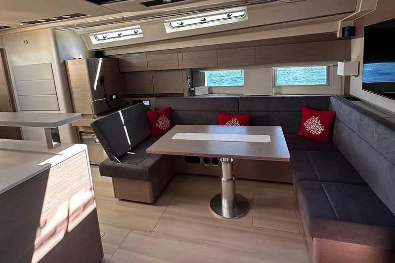 Nil Yacht Photos Pics Luxurious interior of 2024 Hanse 588 yacht with modern seating and ocean view.