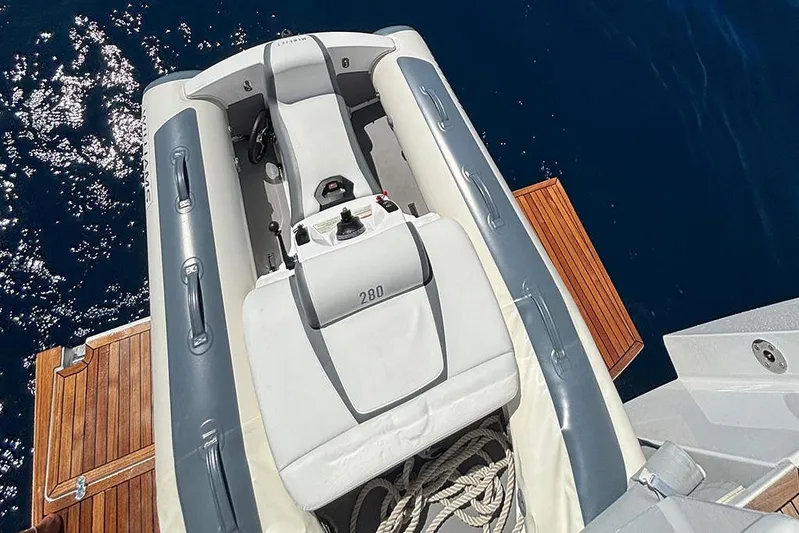 Nil Yacht Photos Pics Inflatable boat on Hanse 588 yacht, 2024 model, docked on wooden platform.