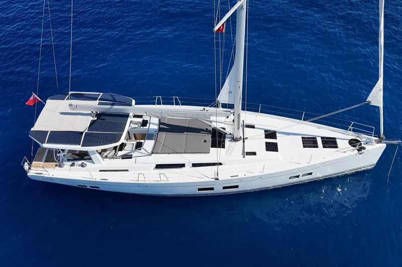 Nil Yacht Photos Pics 2024 Hanse 588 yacht sailing on clear blue ocean waters.