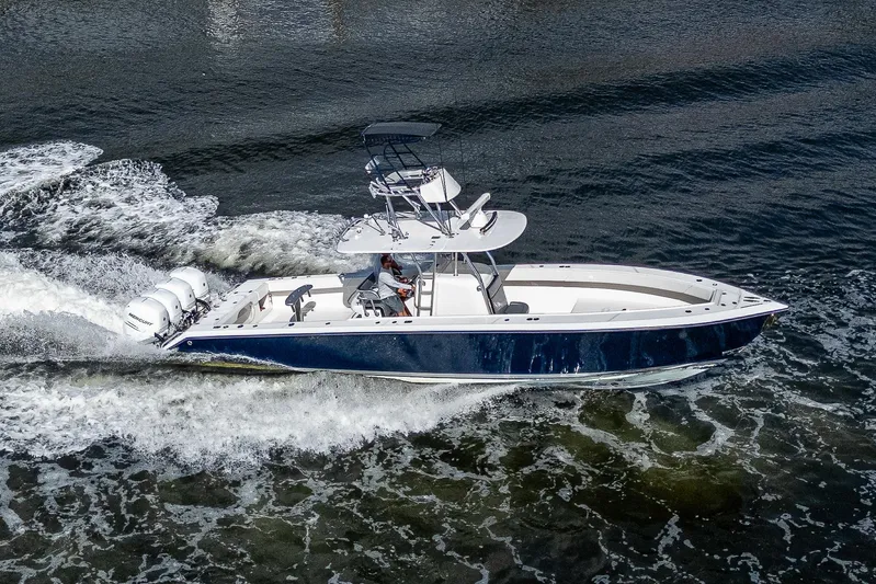  Yacht Photos Pics 2005 Venture 39 Open boat cruising on water.