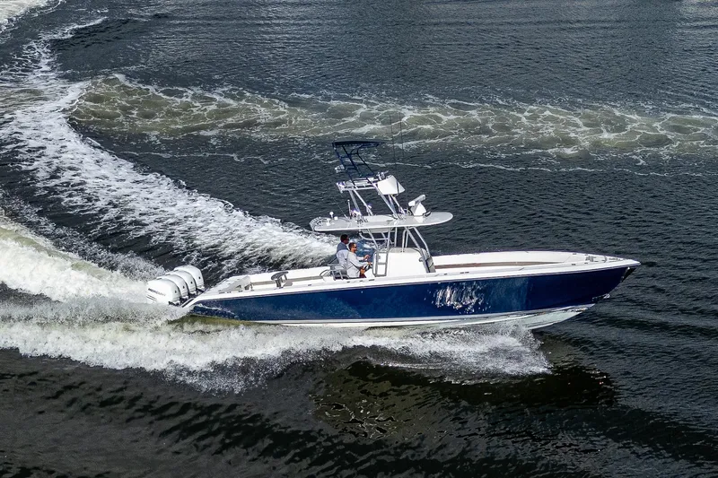  Yacht Photos Pics 2005 Venture 39 Open boat cruising on water.