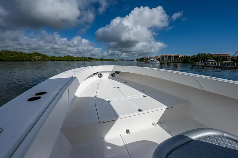  Yacht Photos Pics 2005 Venture 39 Open boat on calm water with clear skies.
