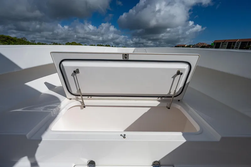  Yacht Photos Pics 2005 Venture 39 Open boat storage compartment under blue sky.