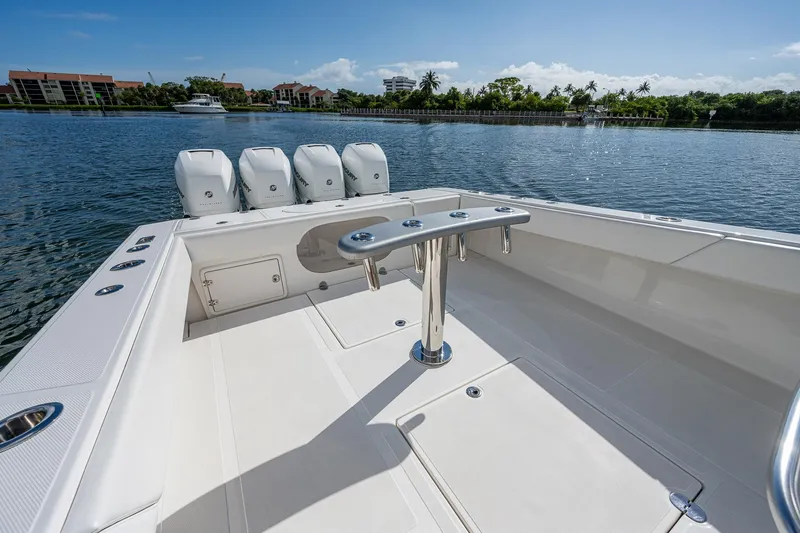  Yacht Photos Pics 2005 Venture 39 Open boat with quad outboard engines on a sunny day.