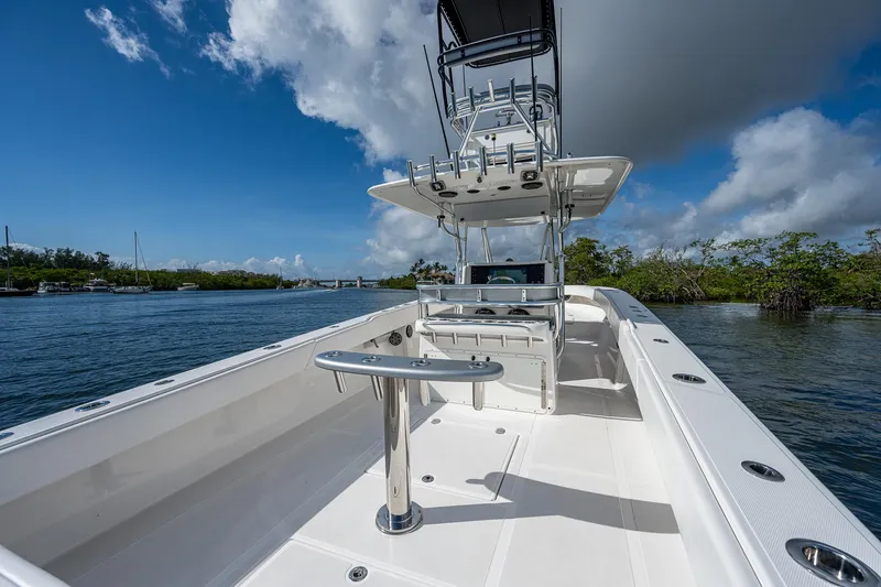  Yacht Photos Pics 2005 Venture 39 Open boat on calm water with clear blue sky.