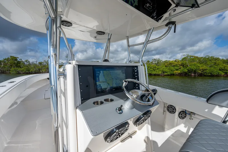  Yacht Photos Pics 2005 Venture 39 Open boat helm with navigation system and steering wheel.