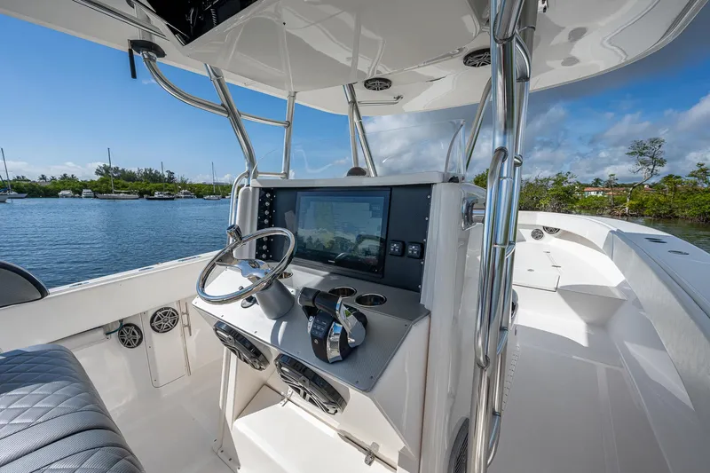  Yacht Photos Pics 2005 Venture 39 Open boat helm with navigation system and steering wheel.