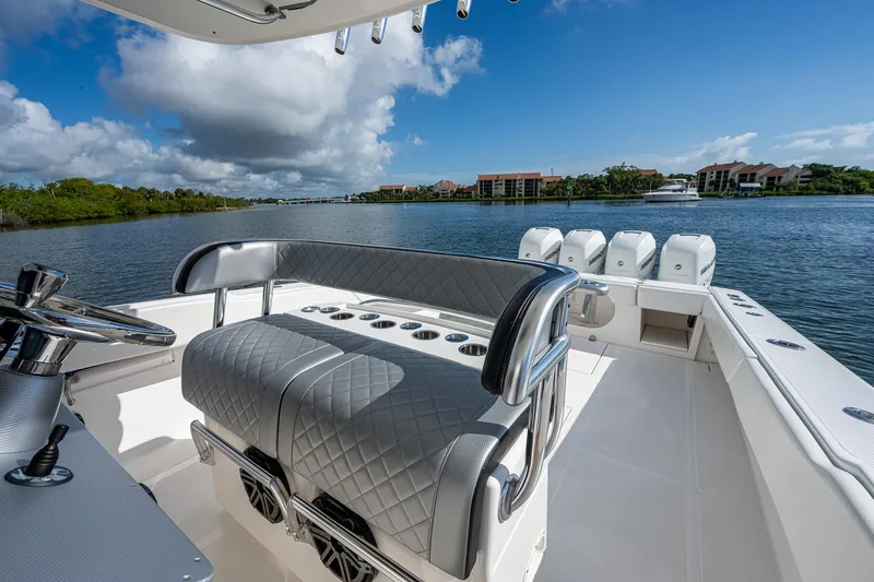  Yacht Photos Pics 2005 Venture 39 Open boat interior with seating and scenic waterfront view.