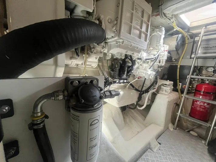  Yacht Photos Pics Engine room of 2010 Atlantis 55 yacht, featuring mechanical components and safety equipment.