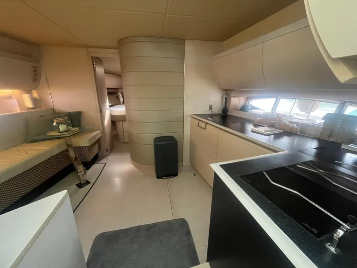  Yacht Photos Pics Luxurious interior of 2010 Atlantis 55 yacht with modern kitchen and cozy seating area.