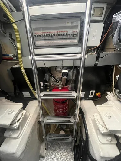  Yacht Photos Pics Engine room of 2010 Atlantis 55 yacht with ladder and fire extinguisher.