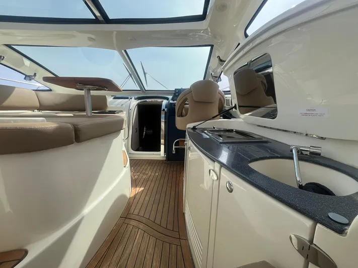  Yacht Photos Pics Luxurious interior of 2010 Atlantis 55 yacht with modern seating and sleek design.