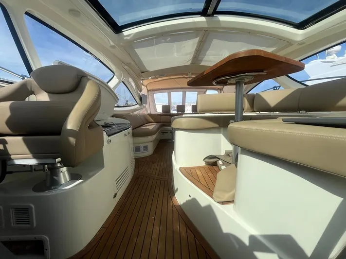  Yacht Photos Pics Interior of 2010 Atlantis 55 yacht with luxurious seating and wooden flooring.