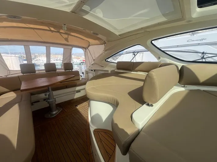  Yacht Photos Pics Luxurious interior of 2010 Atlantis 55 yacht with beige seating and wooden flooring.