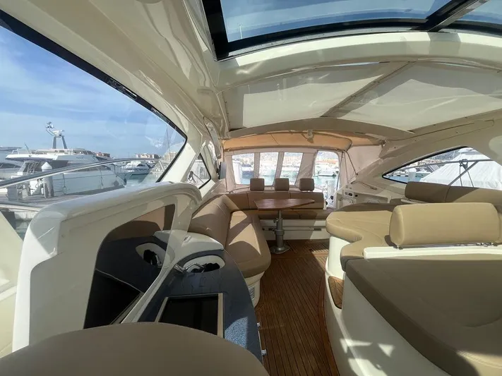  Yacht Photos Pics Luxurious interior of 2010 Atlantis 55 yacht with spacious seating and panoramic windows.