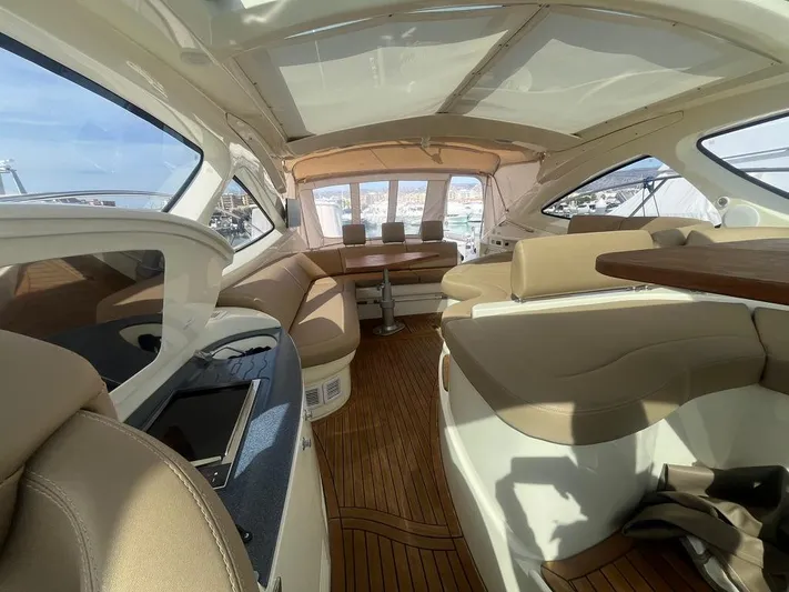  Yacht Photos Pics Luxurious interior of 2010 Atlantis 55 yacht with elegant seating and wooden flooring.