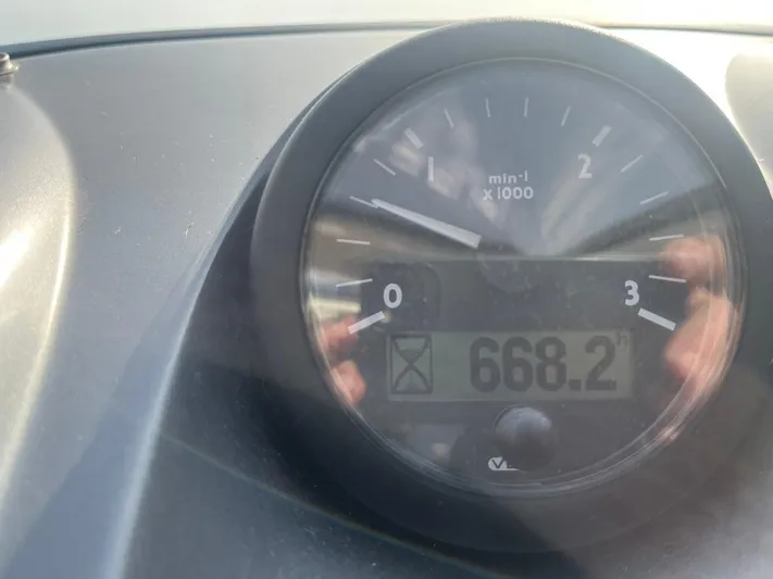  Yacht Photos Pics Close-up of Atlantis 55 tachometer displaying 668.2 RPM, 2010 model.