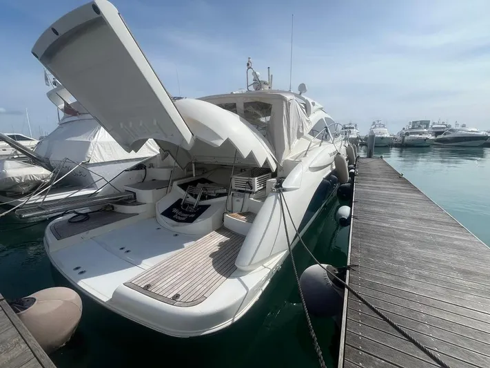  Yacht Photos Pics Luxury yacht Atlantis 55, 2010 model, docked at marina with open hatch.