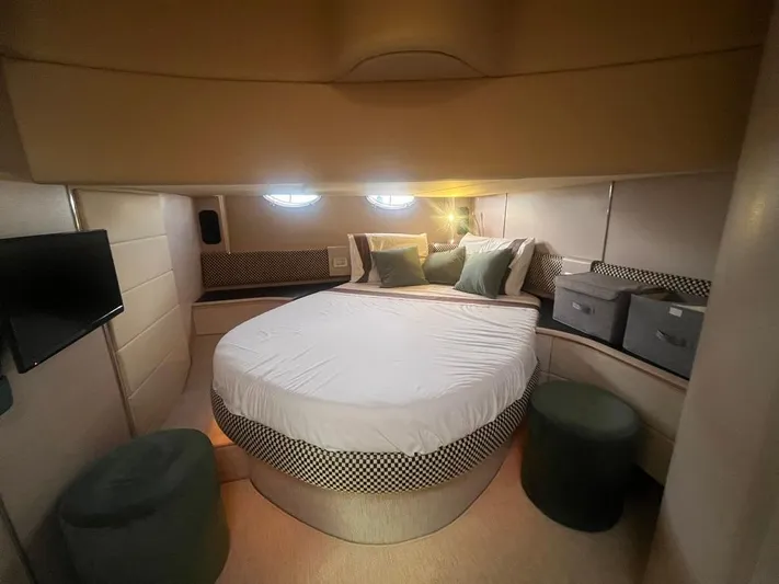  Yacht Photos Pics Luxurious bedroom interior of 2010 Atlantis 55 yacht with round bed and modern decor.