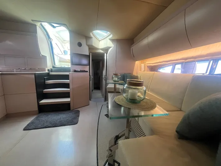  Yacht Photos Pics Luxurious interior of 2010 Atlantis 55 yacht with modern seating and elegant decor.