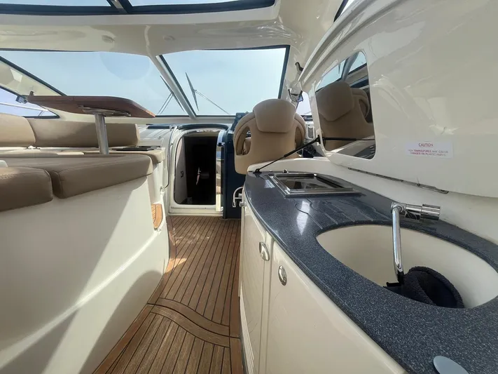  Yacht Photos Pics Luxurious interior of 2010 Atlantis 55 yacht with modern amenities and sleek design.