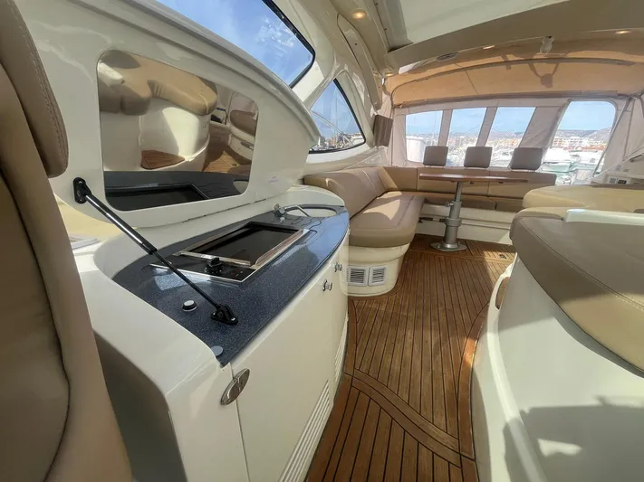  Yacht Photos Pics Luxurious interior of 2010 Atlantis 55 yacht with elegant seating and wooden flooring.