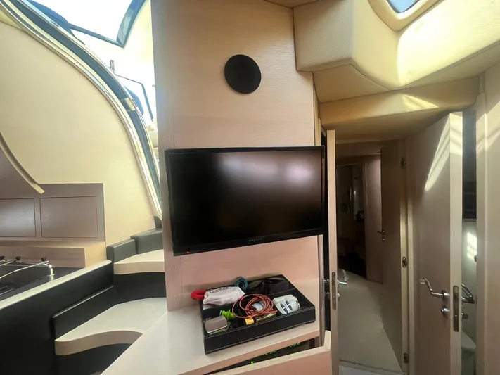  Yacht Photos Pics Interior of 2010 Atlantis 55 yacht with TV and storage area.