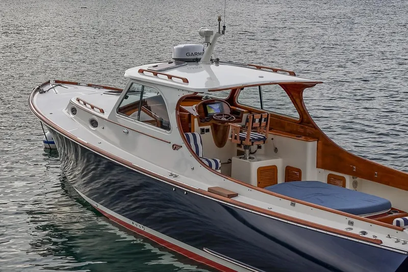 Seaker Yacht Photos Pics 2001 Hinckley Picnic Boat Classic on calm water, showcasing elegant design and craftsmanship.