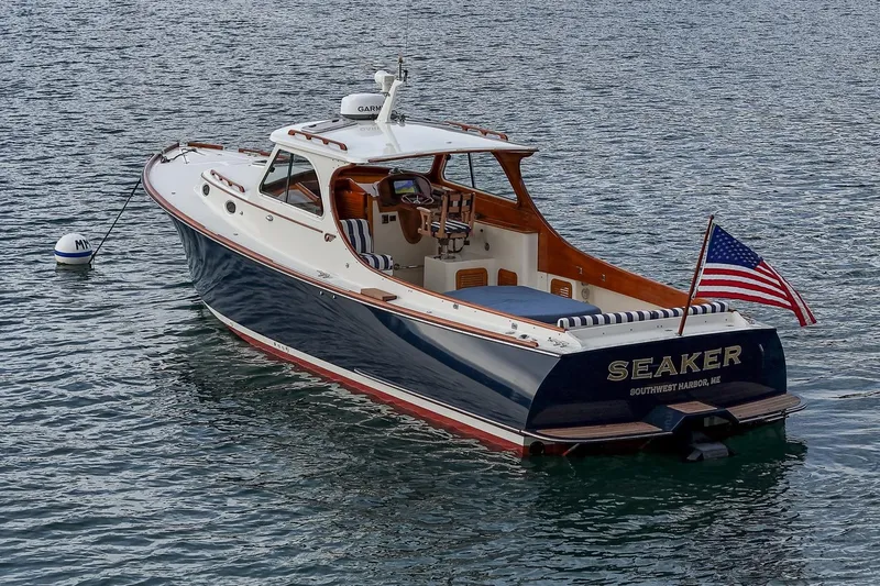 Seaker Yacht Photos Pics 2001 Hinckley Picnic Boat Classic on water, displaying American flag.