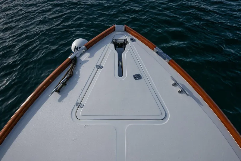 Seaker Yacht Photos Pics Bow of 2001 Hinckley Picnic Boat Classic on calm water.
